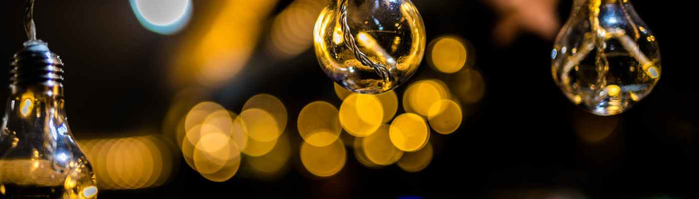 close up photo of three hanging light bulbs