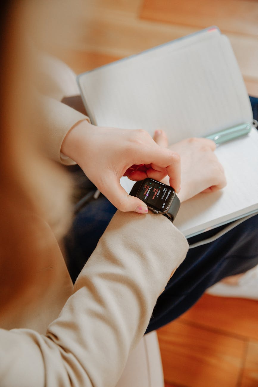 person wearing black smart watch